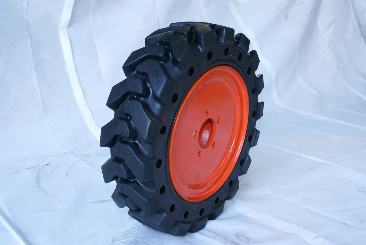 A close up of an orange tire on a white background