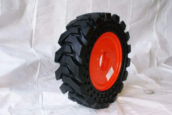 A tire with red rim on white background