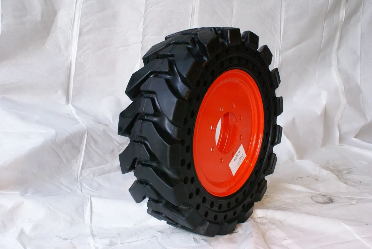 A tire with red rim on white background