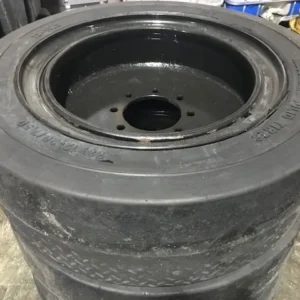 A stack of tires that are sitting on the floor.