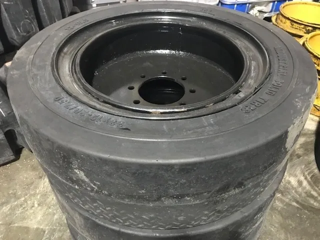 A stack of tires that are sitting on the floor.