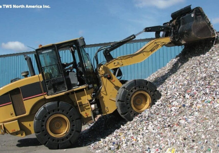 A yellow and black tractor is on the ground